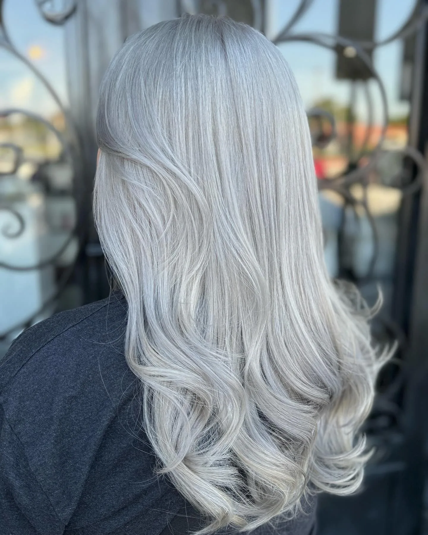 10. Polished Platinum with Soft Curls (Ash Platinum Hair Color)