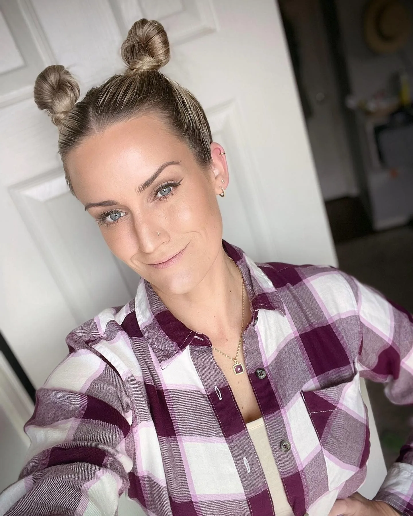 10. Tight Twisted Buns with Honey Blonde Highlights (Space Buns Hairstyles)