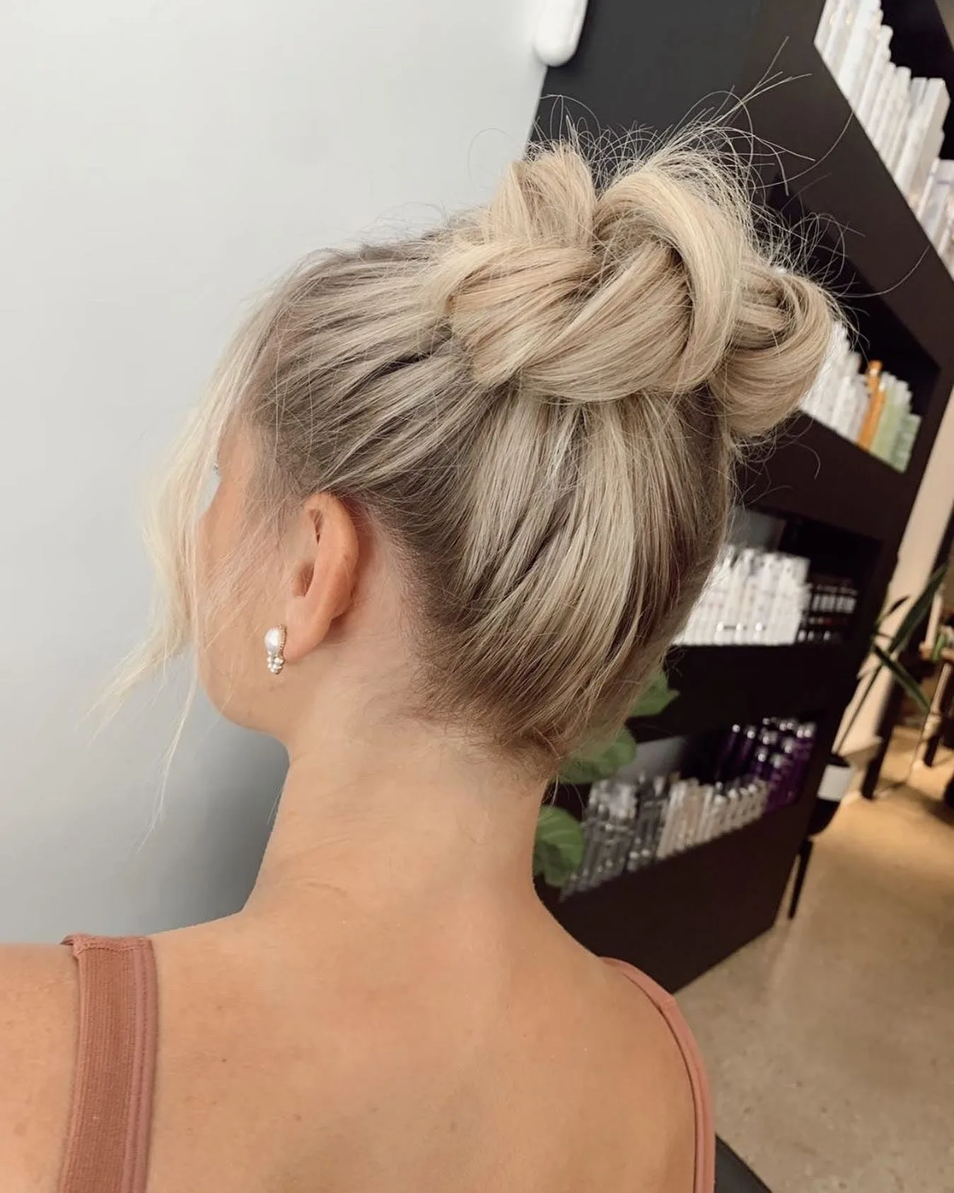 11. Twisted High Space Buns on Icy Blonde Hair (Space Buns Hairstyles)