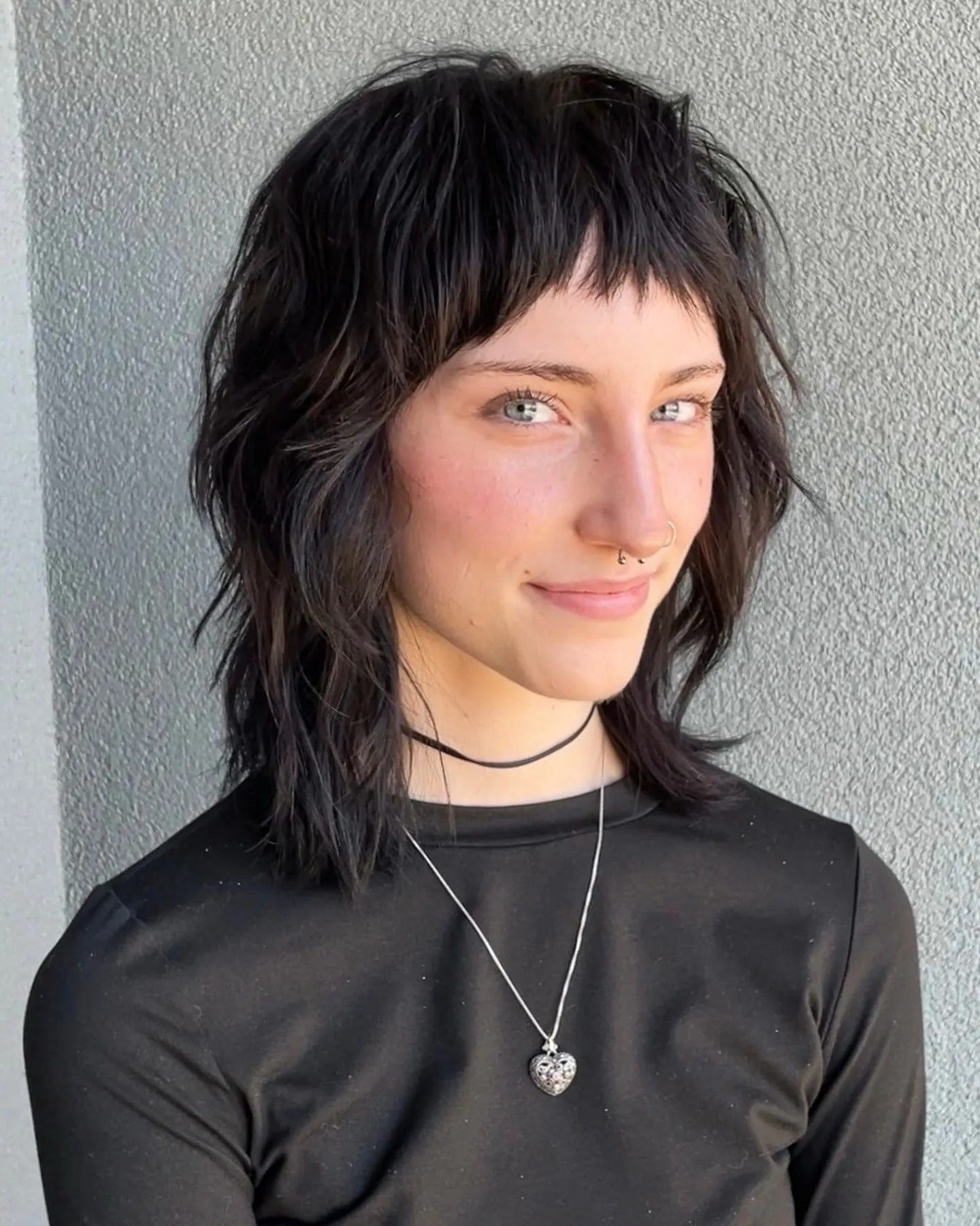 12. Inky Black Wolf Cut with Choppy Fringe (Wolf Haircut)