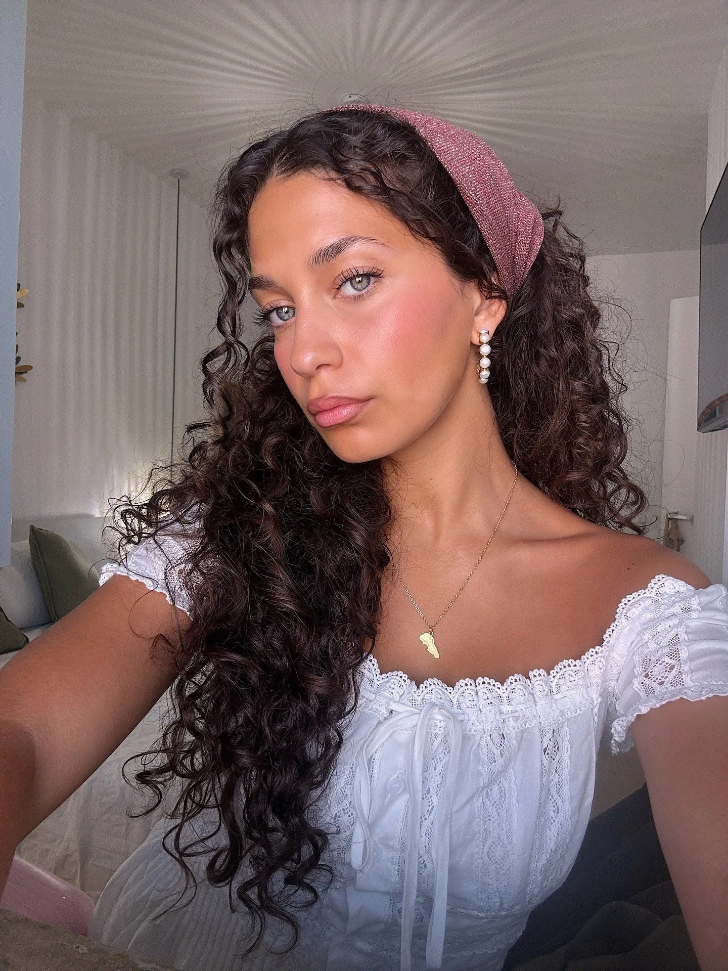 13. Deep Brunette Waves with Headband (Messy Curly Hair)