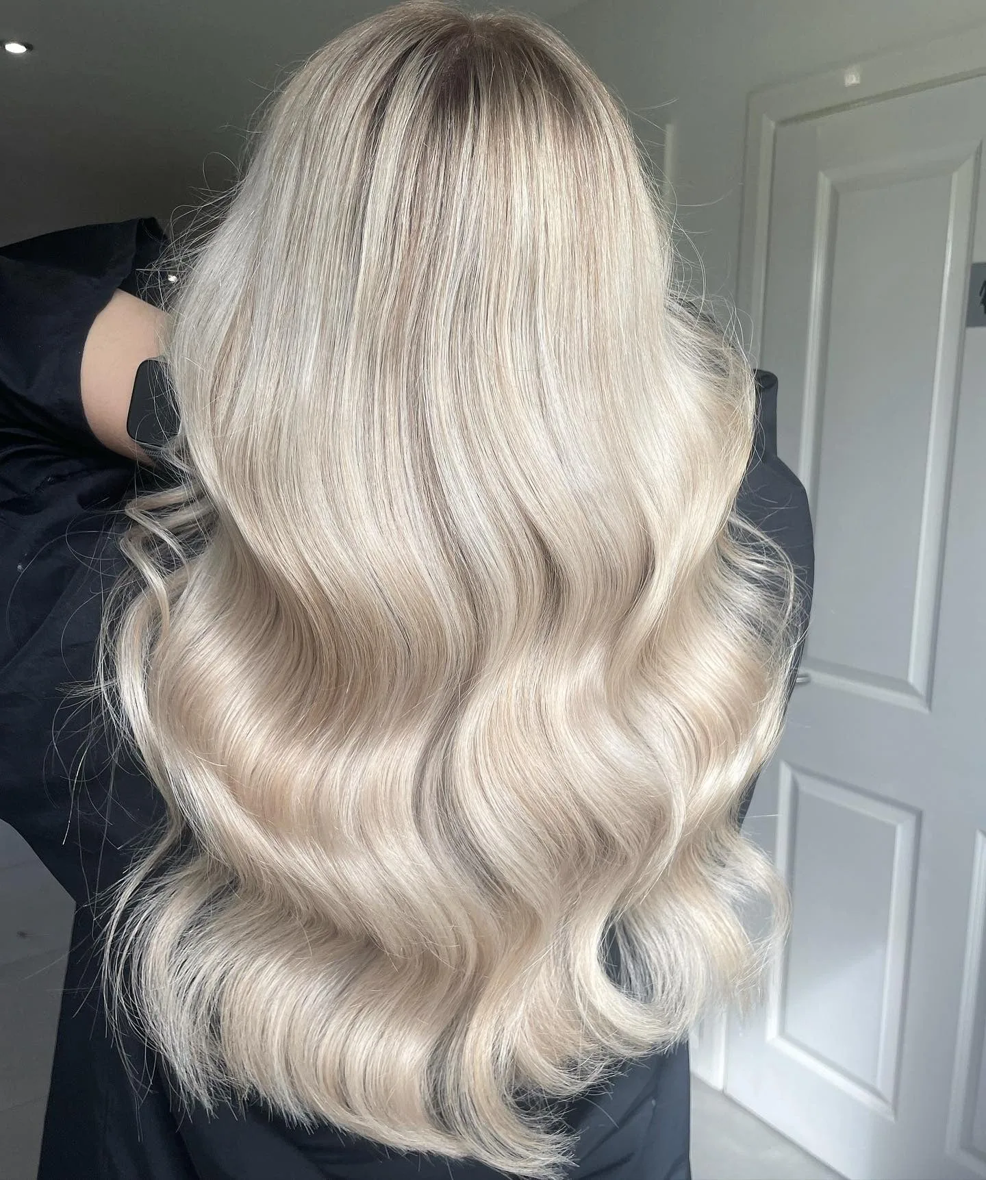 13. Polished Platinum Waves (Icy Blonde Hair Color)