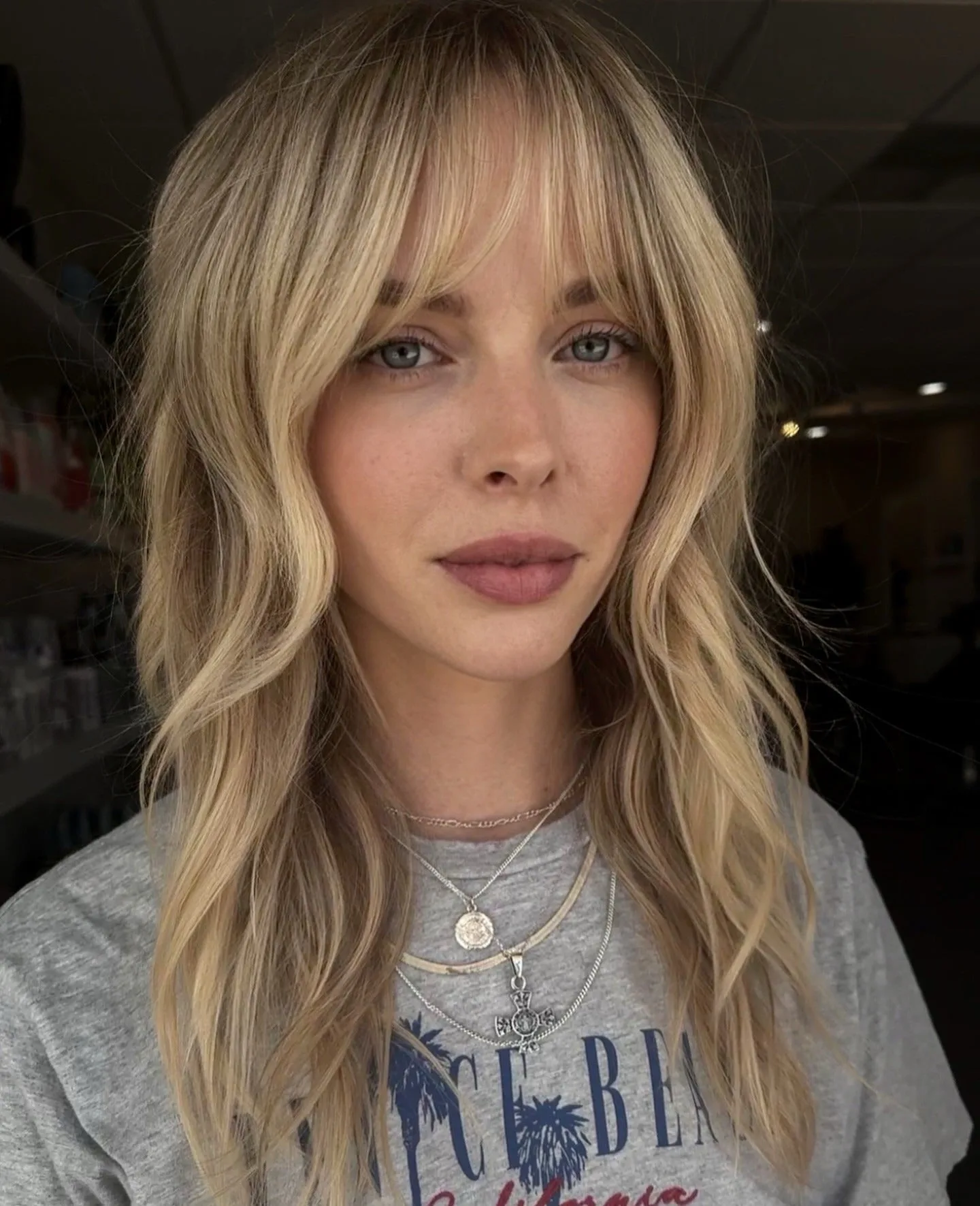 14. Golden Butter Blonde Shag with Curtain Fringe (Medium Layered Shag)
