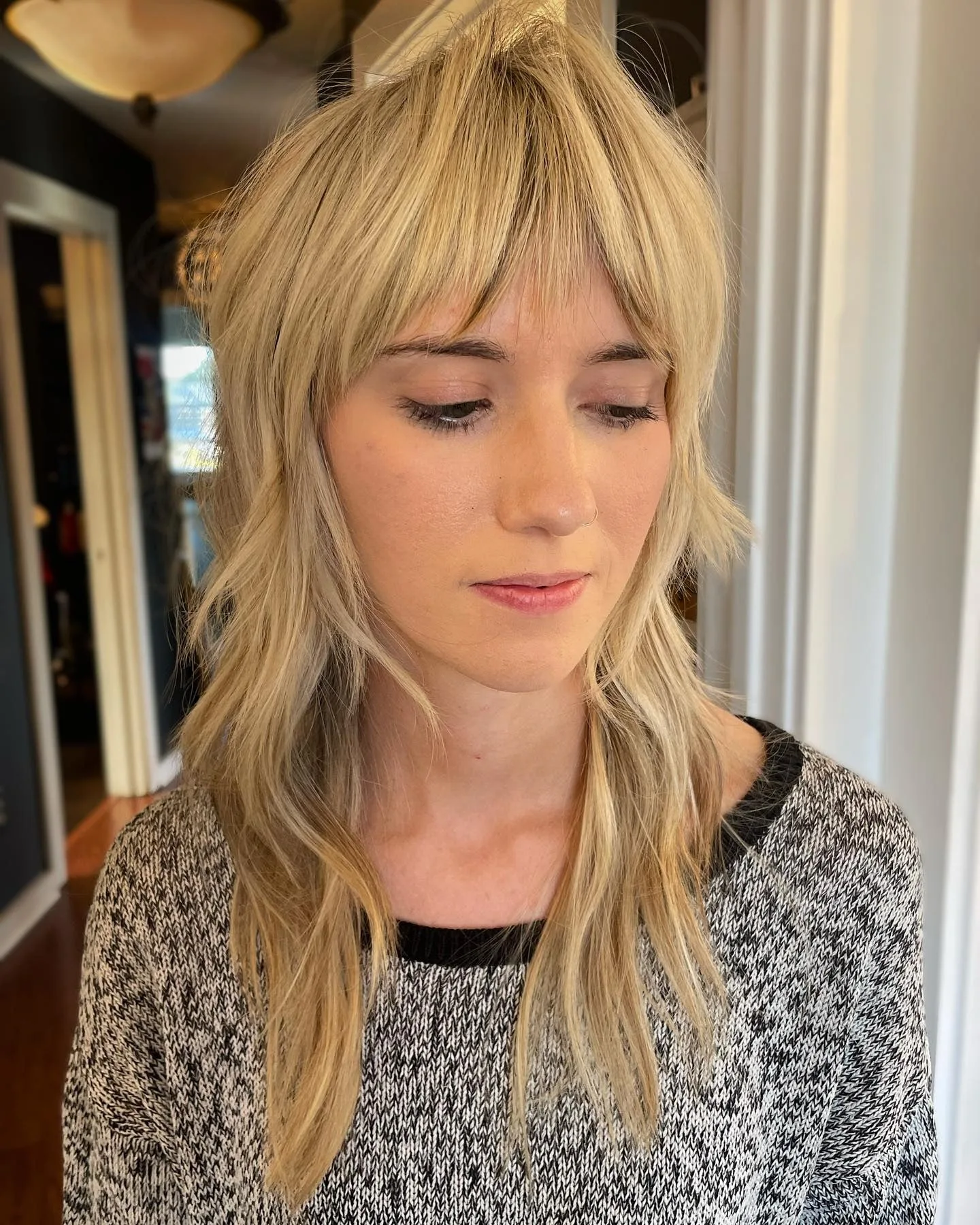 5. Beige Blonde Shag with Wispy Layers (Medium Layered Shag)
