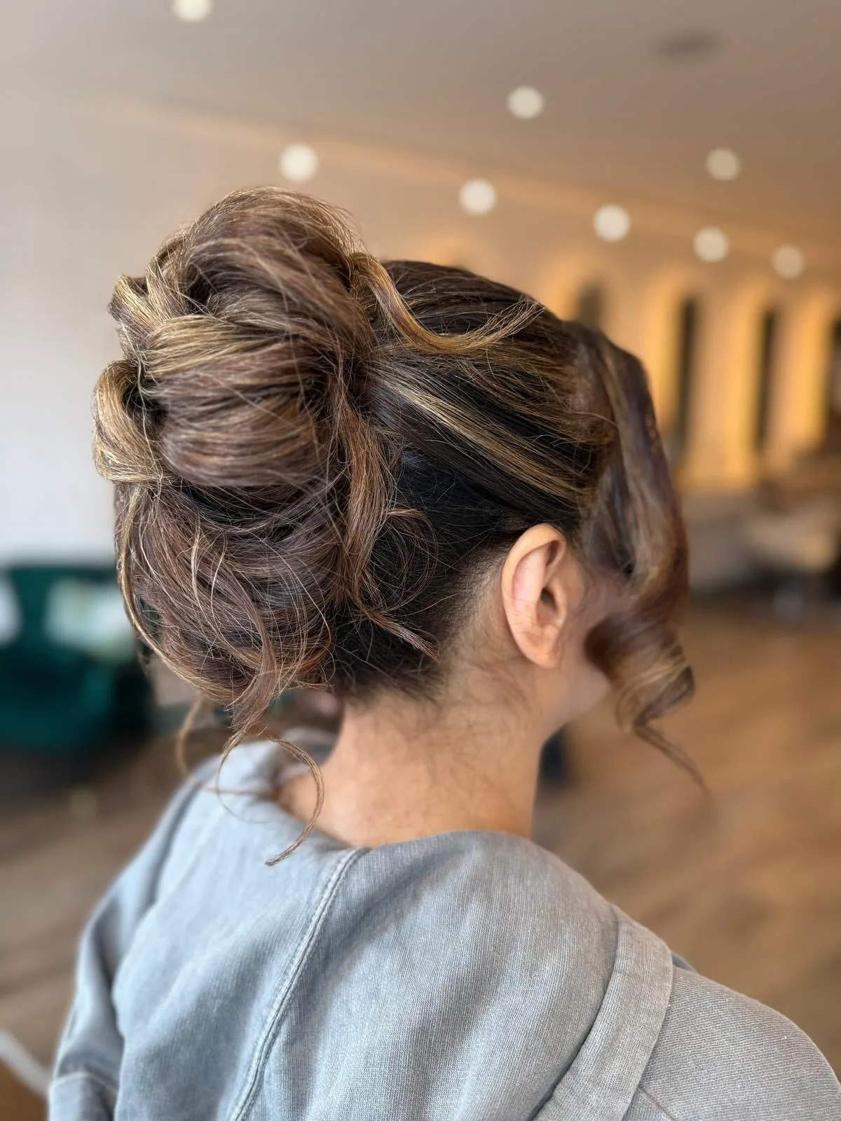 1. Textured Caramel Twist Bun (Messy Bun Hairstyles)