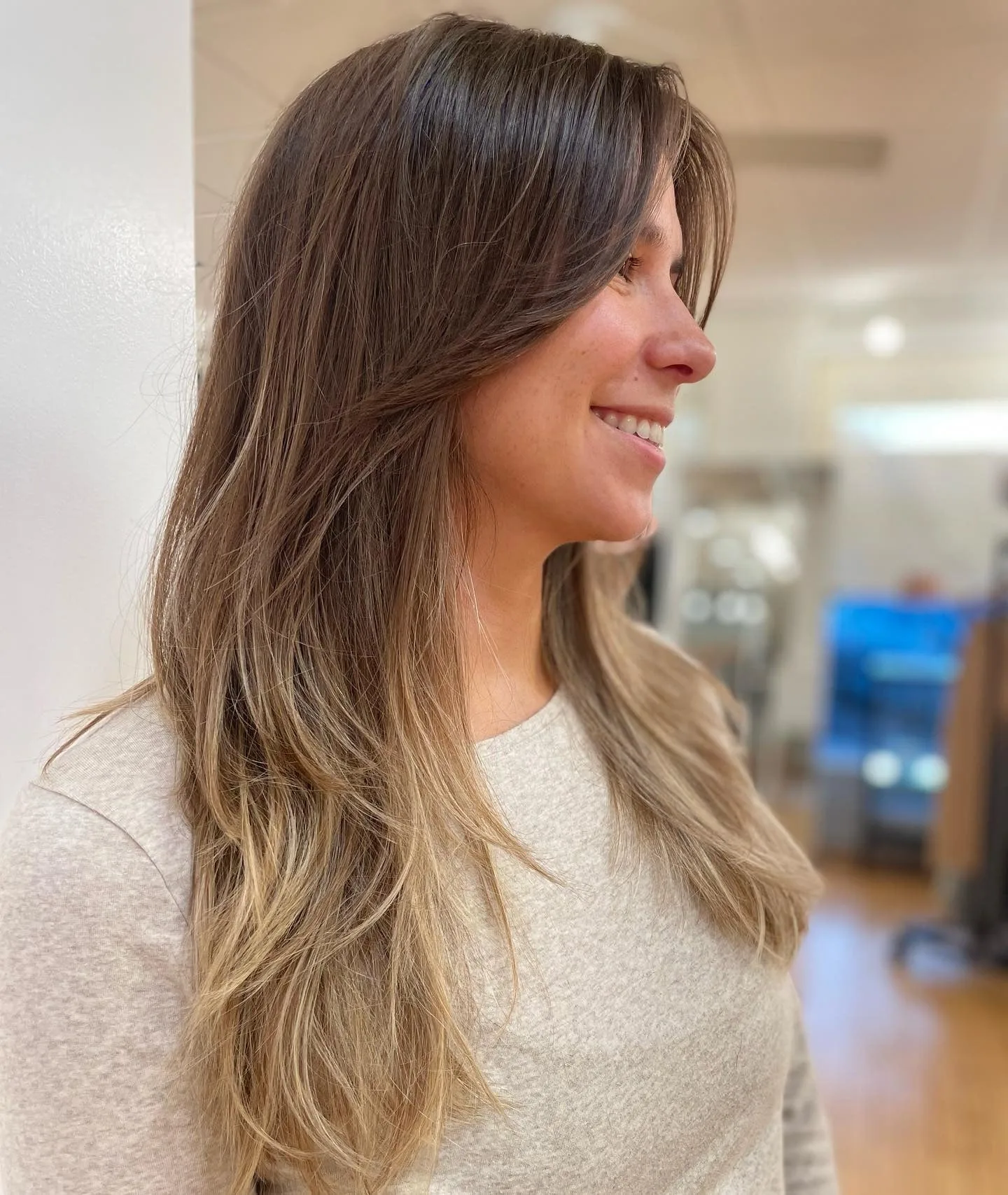 10. Ash Brown Layers with Sun-Kissed Ends (Long Textured Layers)