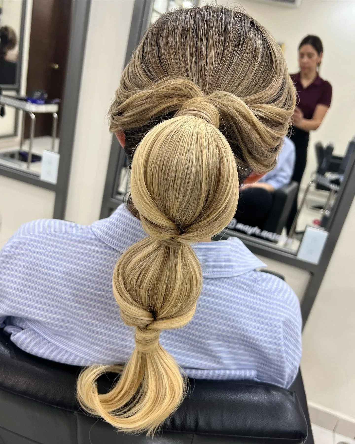 10. Dimensional Blonde Bubble Ponytail with Twisted Accents (Bubble Ponytail Hairstyles)