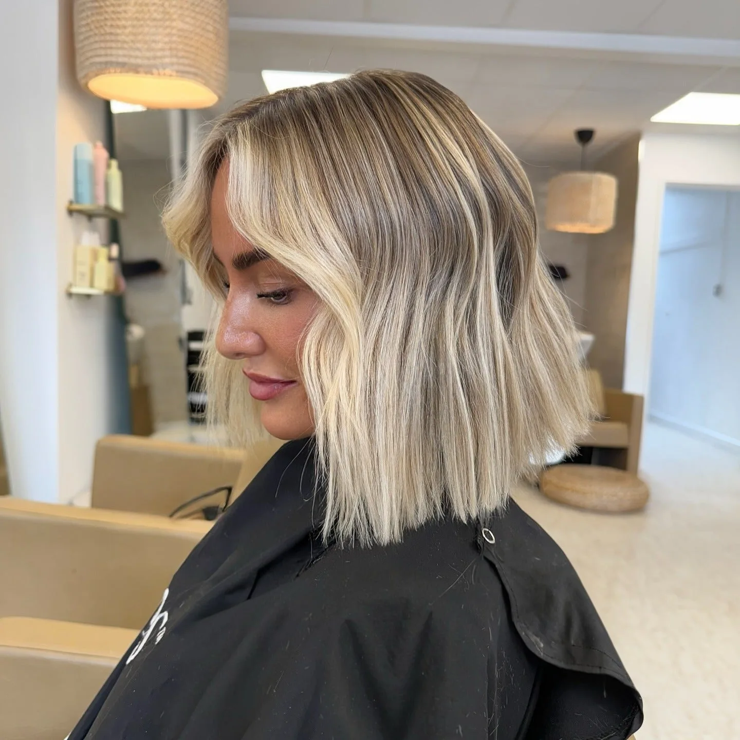11. Creamy Blonde Bob with Sleek Texture (Messy Bob Haircut)