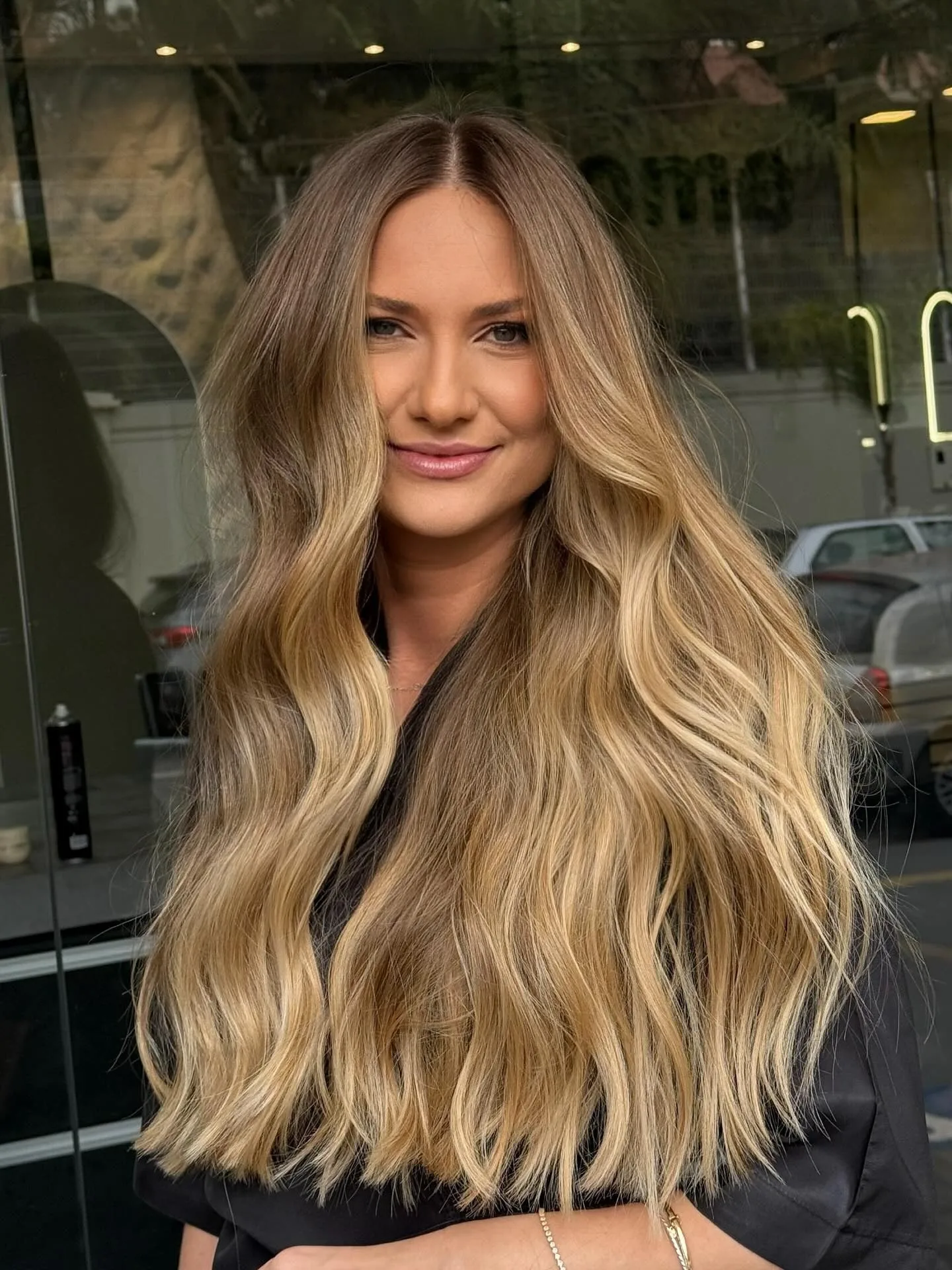 12. Golden Balayage Elegance (Caramel Honey Blonde)