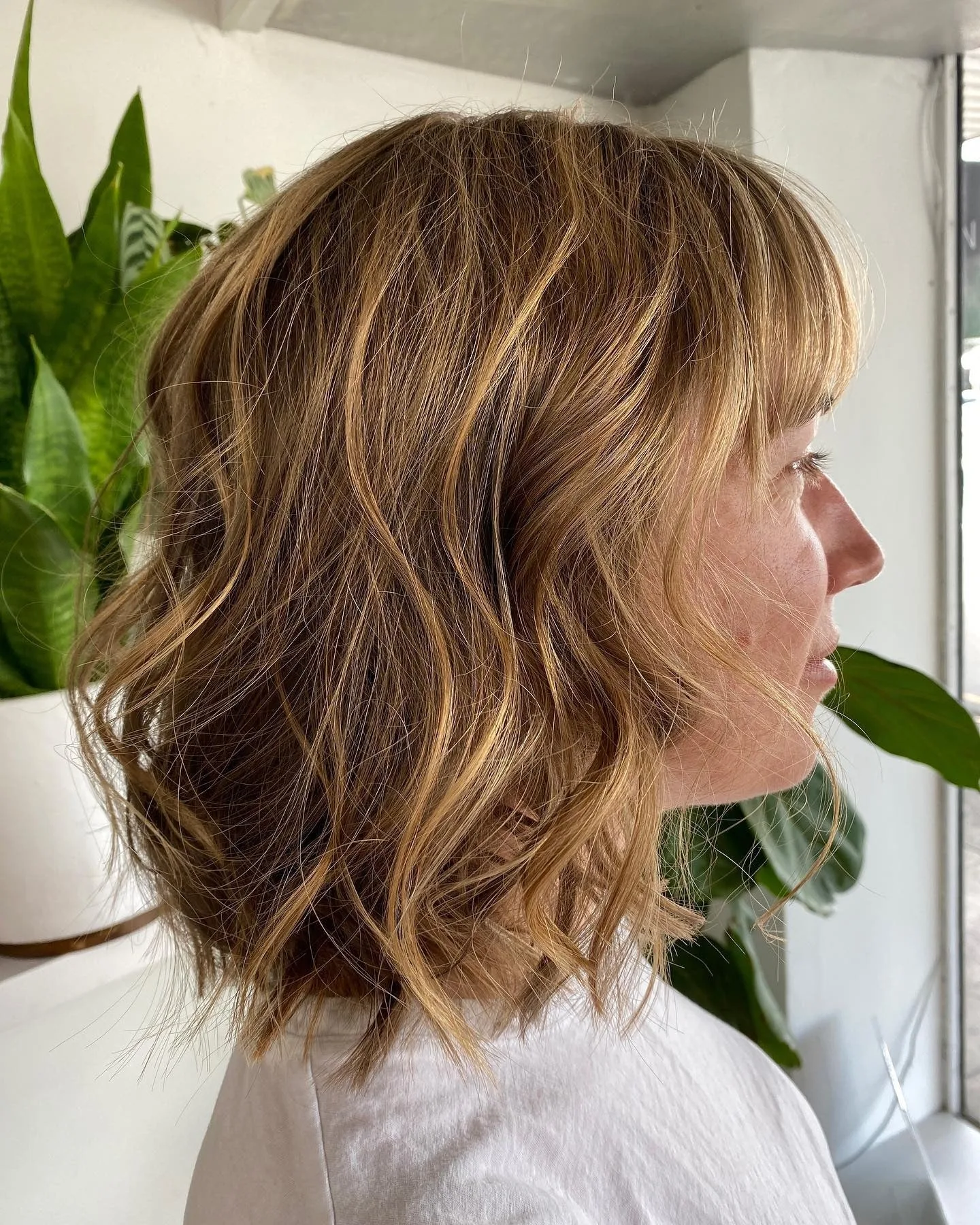 14. Golden Copper Wavy Bob with Light Fringe (Messy Bob Haircut)