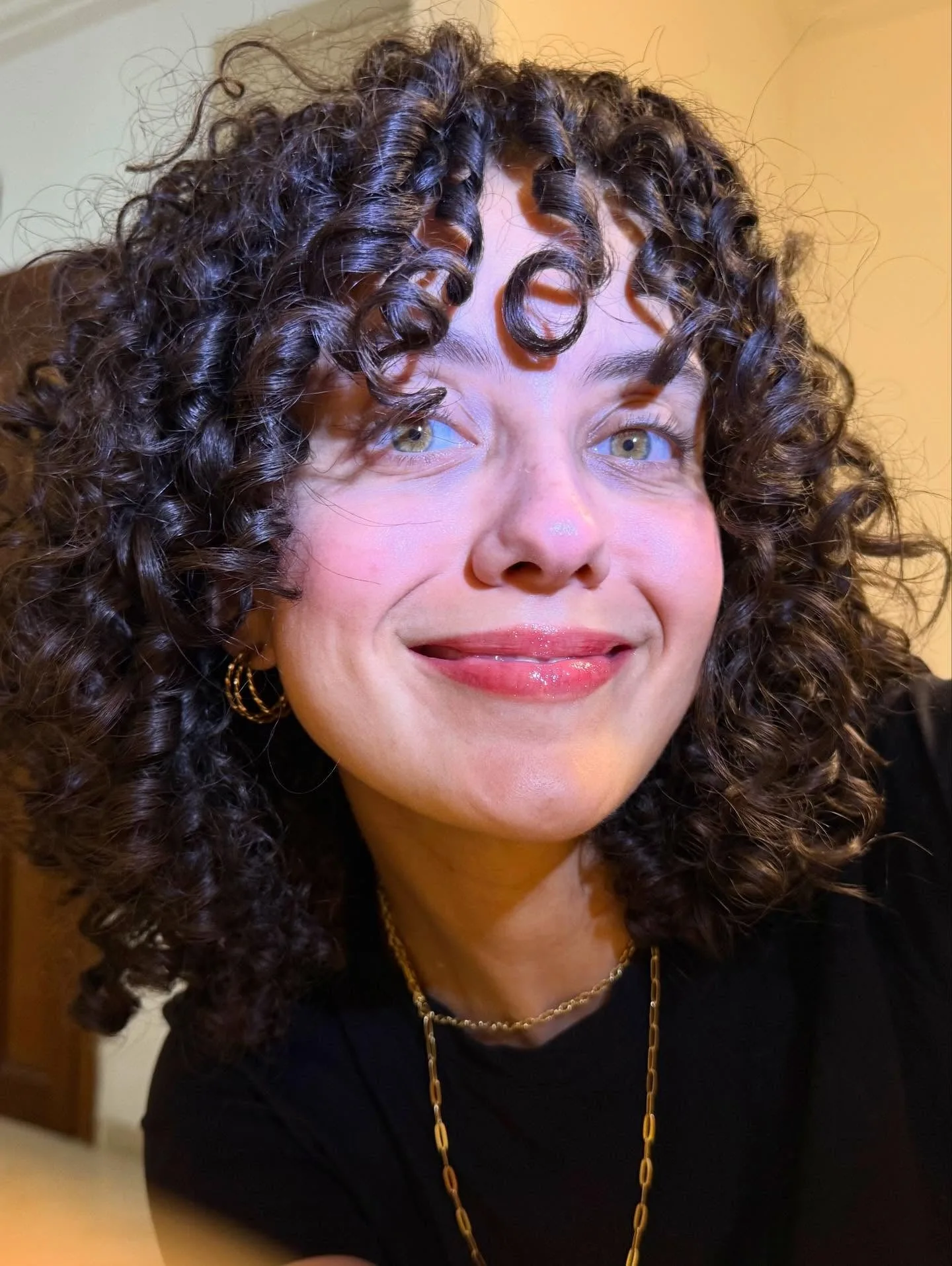 2. Short Coils with Feathered Bangs (Wispy Bangs For Curly Hair)