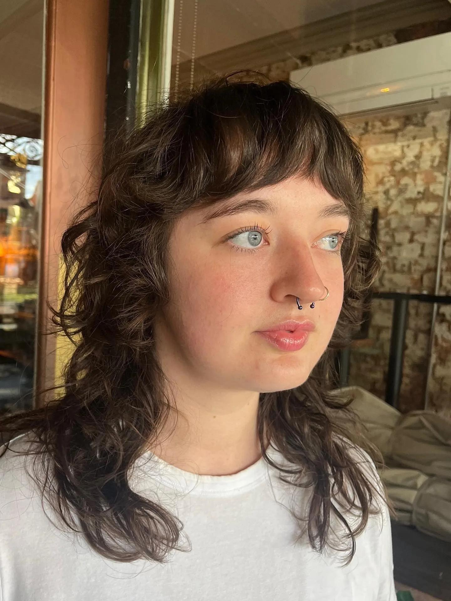 2. Textured Brunette Shag with Micro Bangs (Shaggy Haircuts)