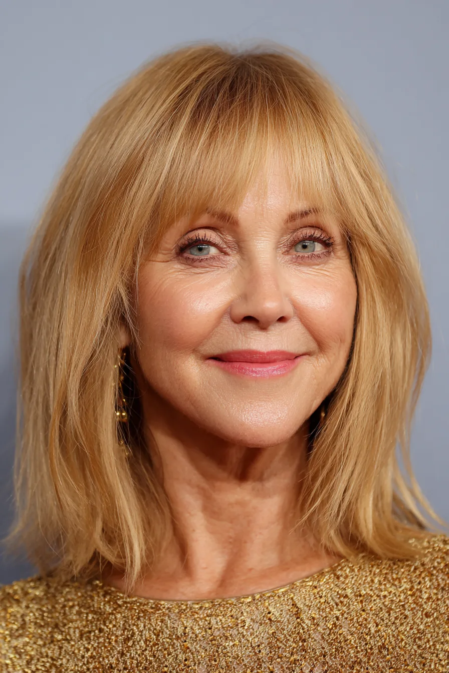20. Mid-Length Cut With Blended Bangs in Honey Blonde (Haircuts With Bangs For Women Over 50) - Haircuts With Bangs For Women Over 50
