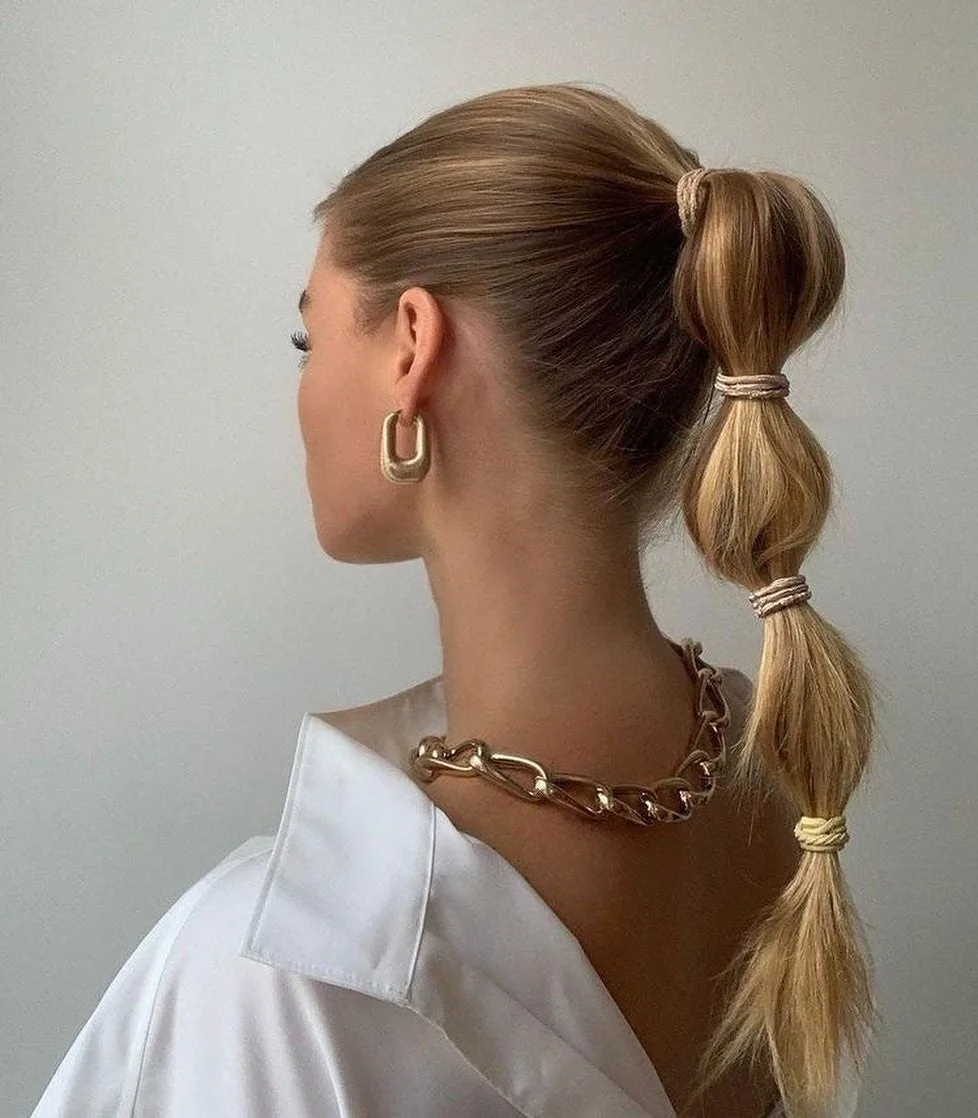 3. Sleek Golden Bubble Ponytail with Minimalist Glam (Bubble Ponytail Hairstyles)