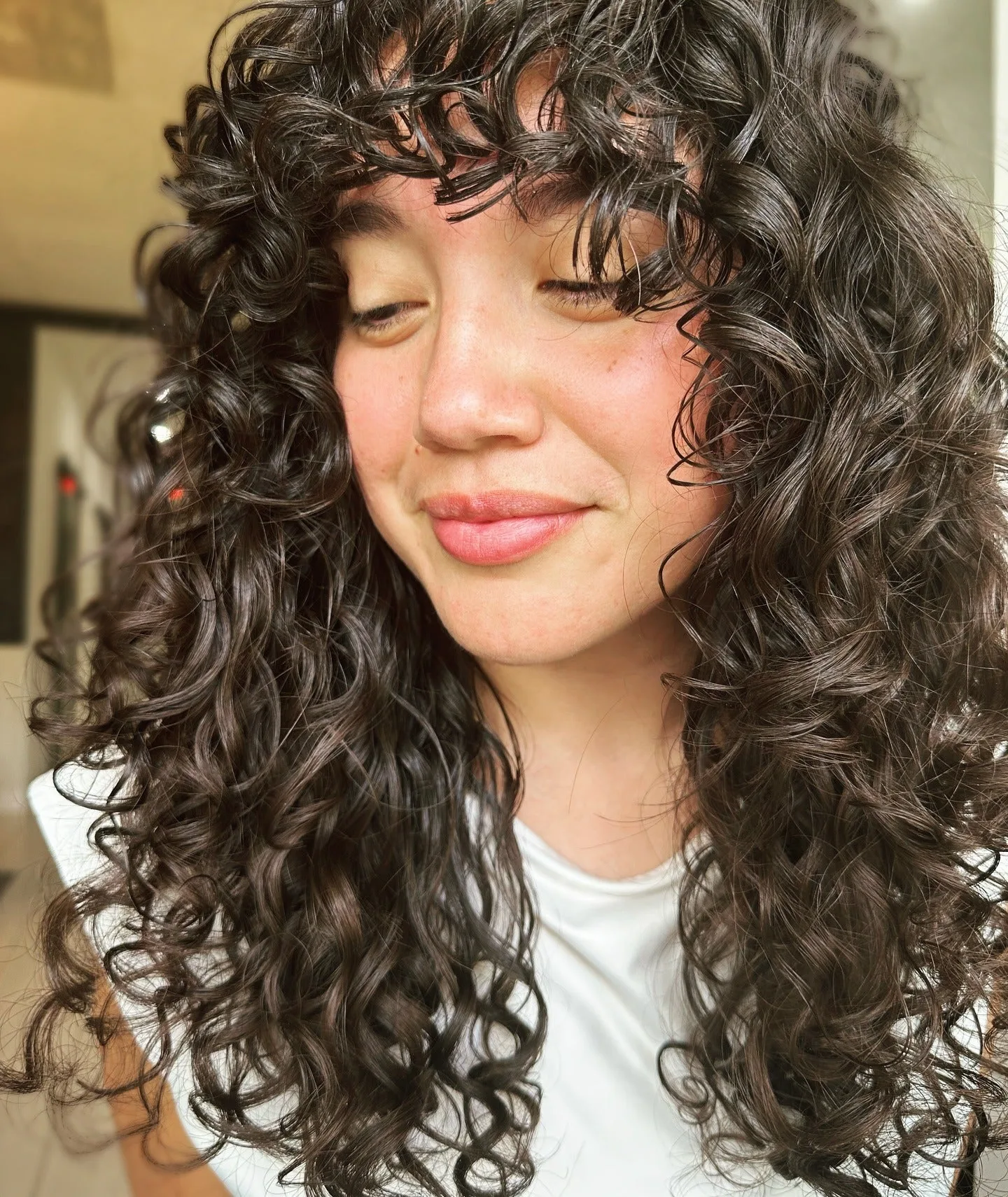 4. Mid-Length Curls with Soft Face Framing (Wispy Bangs For Curly Hair)