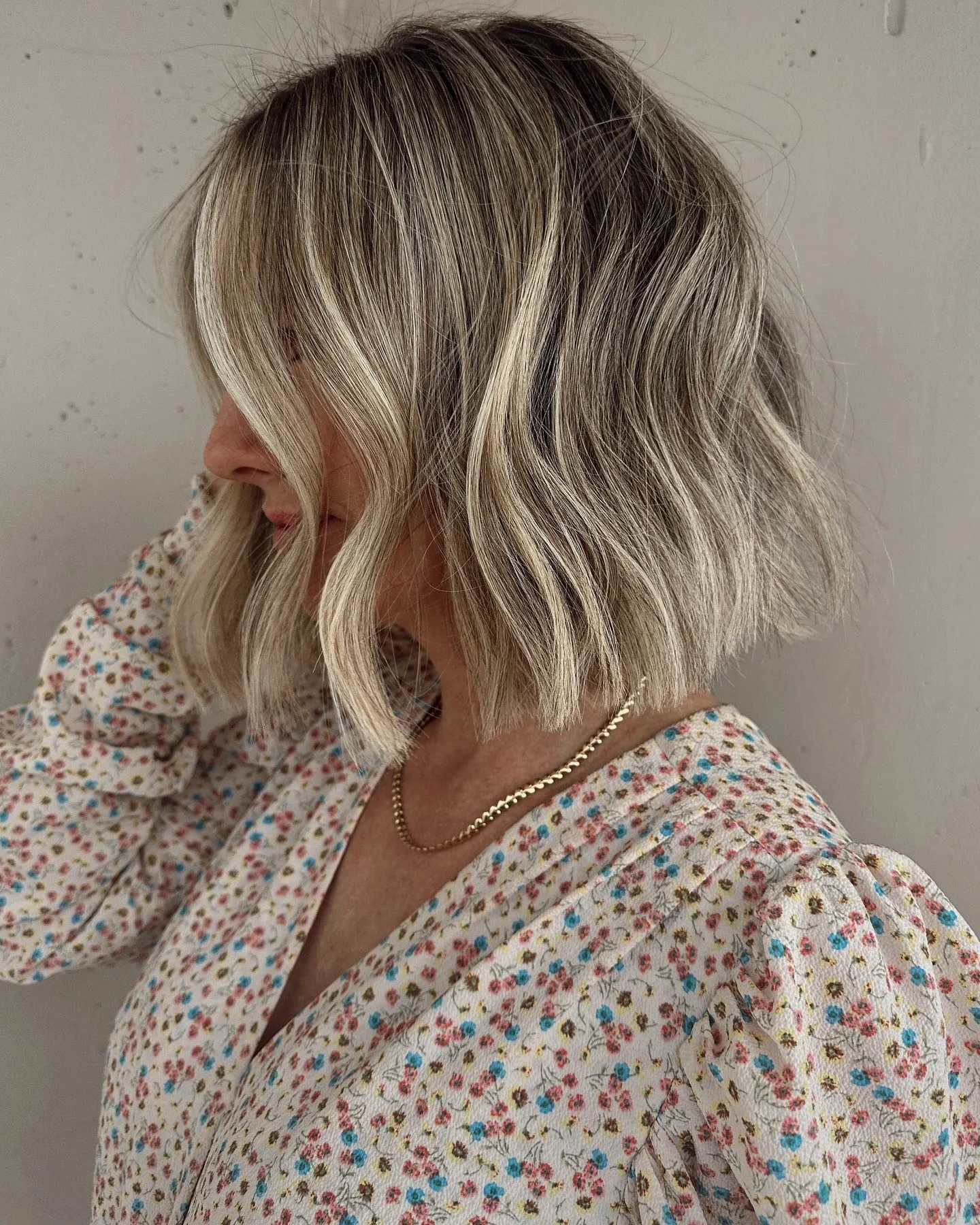 5. Ash Blonde Wavy Bob with Face-Framing Layers (Messy Bob Haircut)