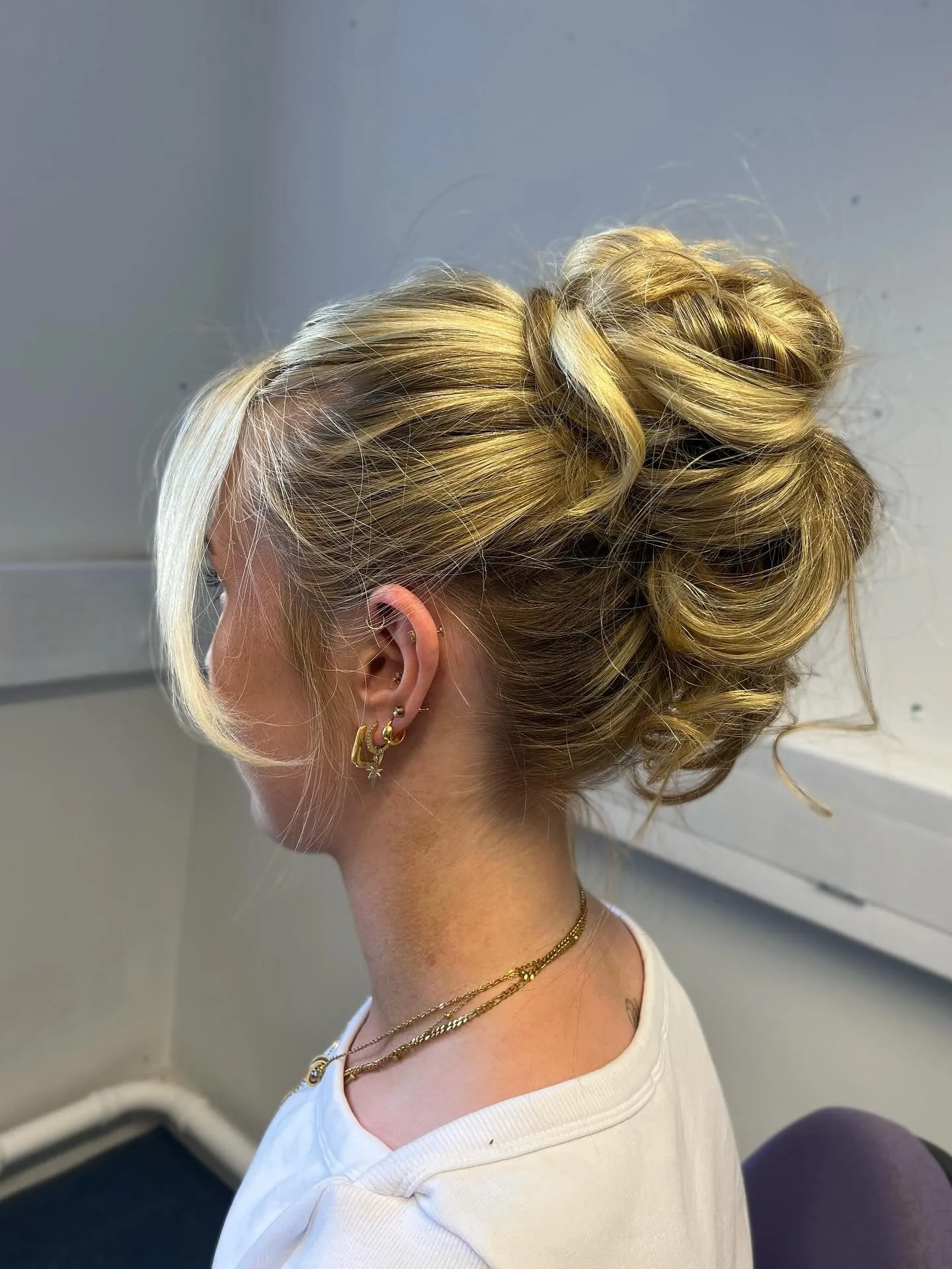 5. Glossy Honey Blonde Bun (Messy Bun Hairstyles)