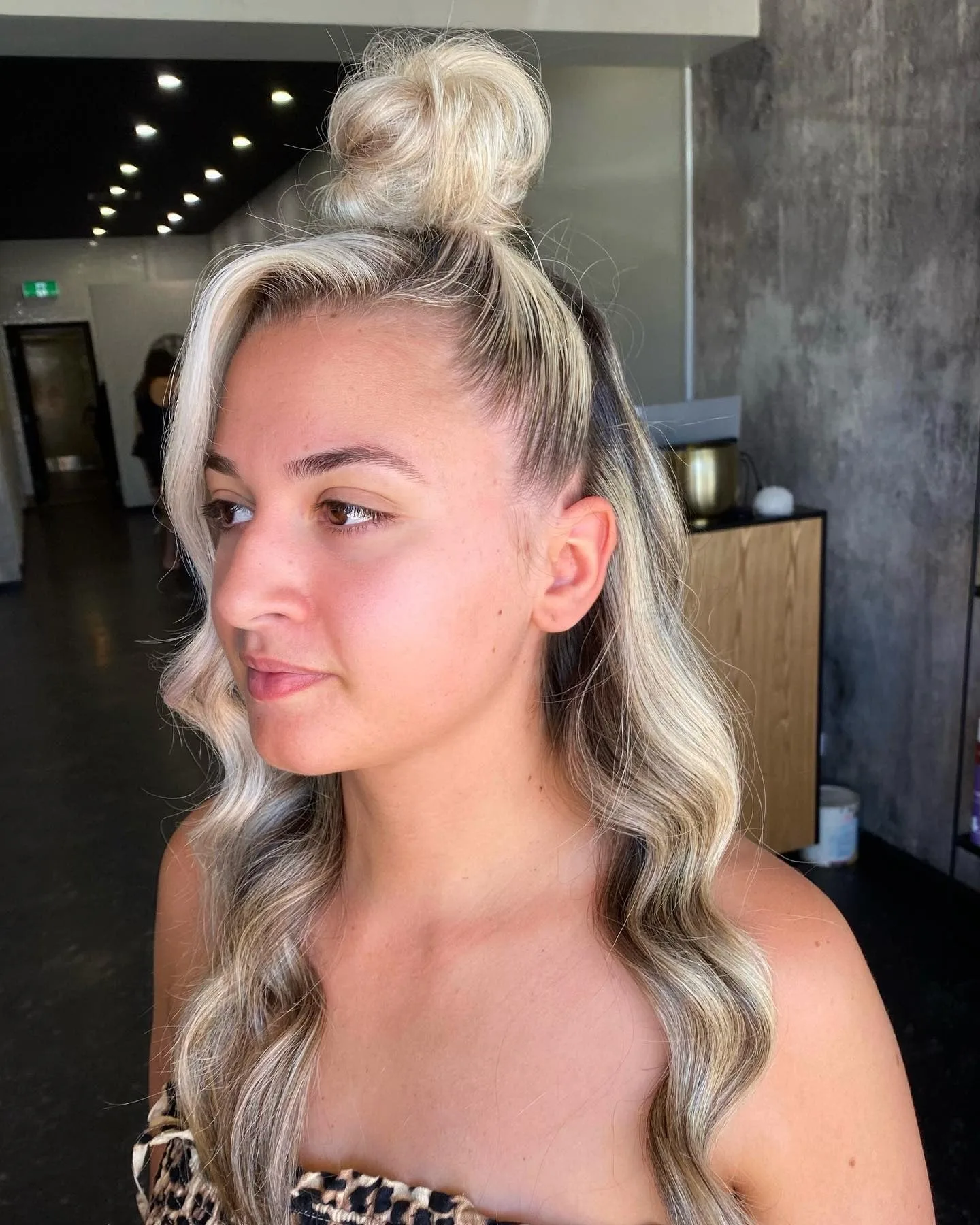 6. Half-Up Blonde Knot with Cascading Waves (Top Knot Hairstyles)