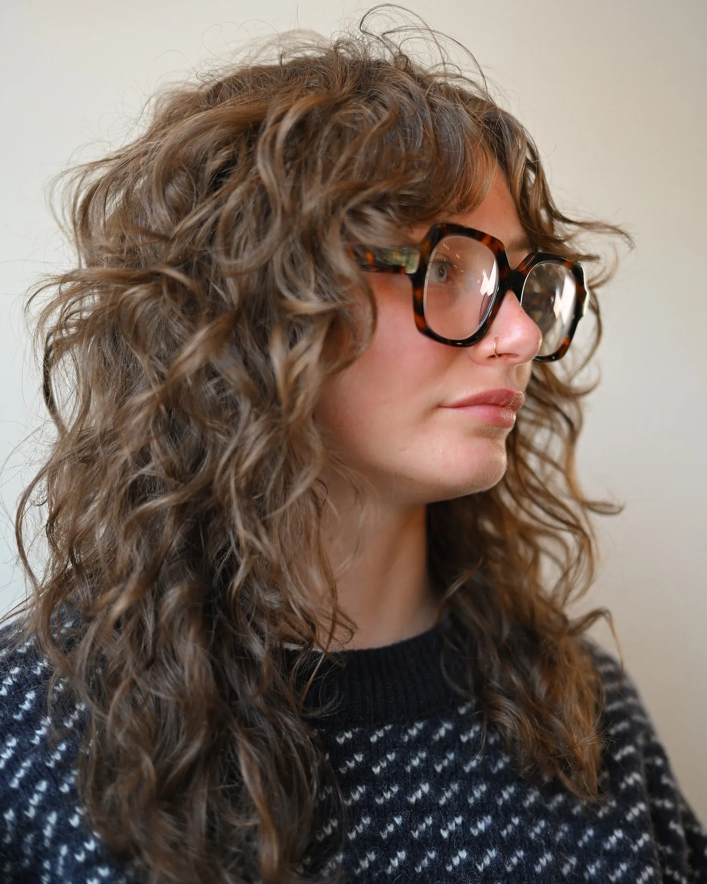 6. Tousled Layers with Airy Fringe (Wispy Bangs For Curly Hair)