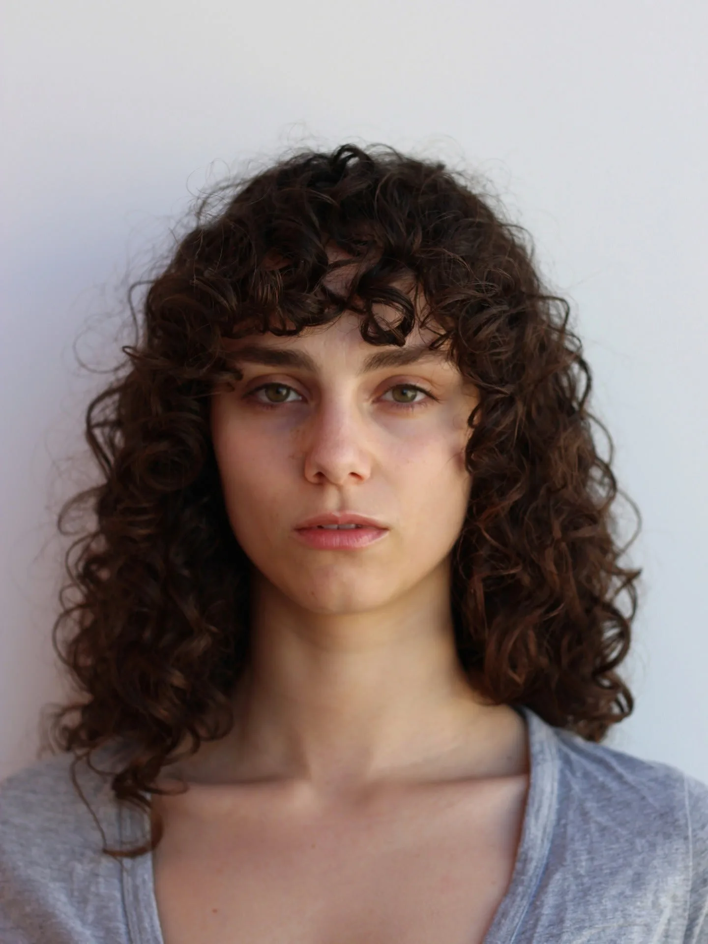 7. Curly Shag with Soft Wisps (Wispy Bangs For Curly Hair)