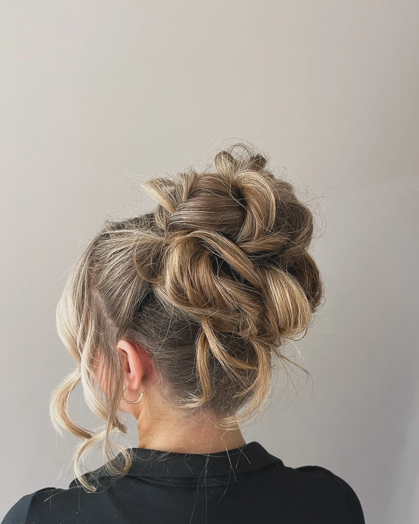 8. Braided Brunette Bun with Blonde Accents (Messy Bun Hairstyles)
