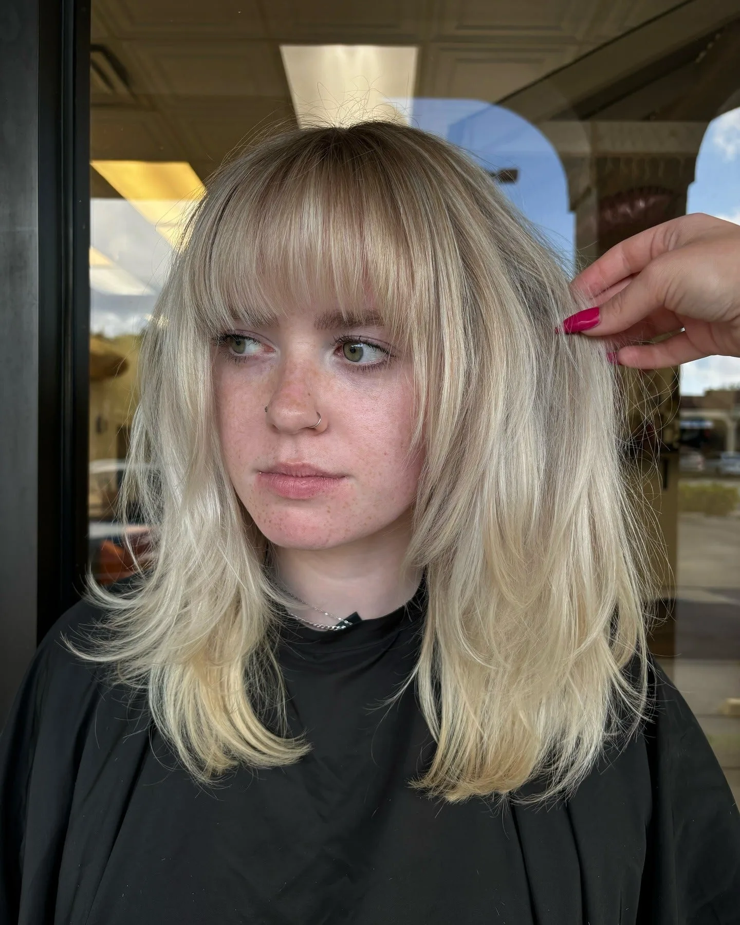 9. Ash Blonde Feathered Shag with Blunt Bangs (Shaggy Haircuts)