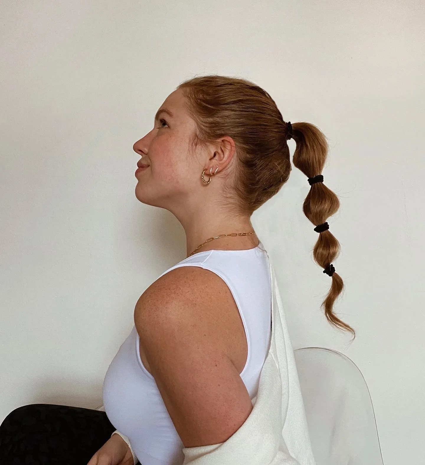 9. Auburn Bubble Ponytail with Textured Movement (Bubble Ponytail Hairstyles)