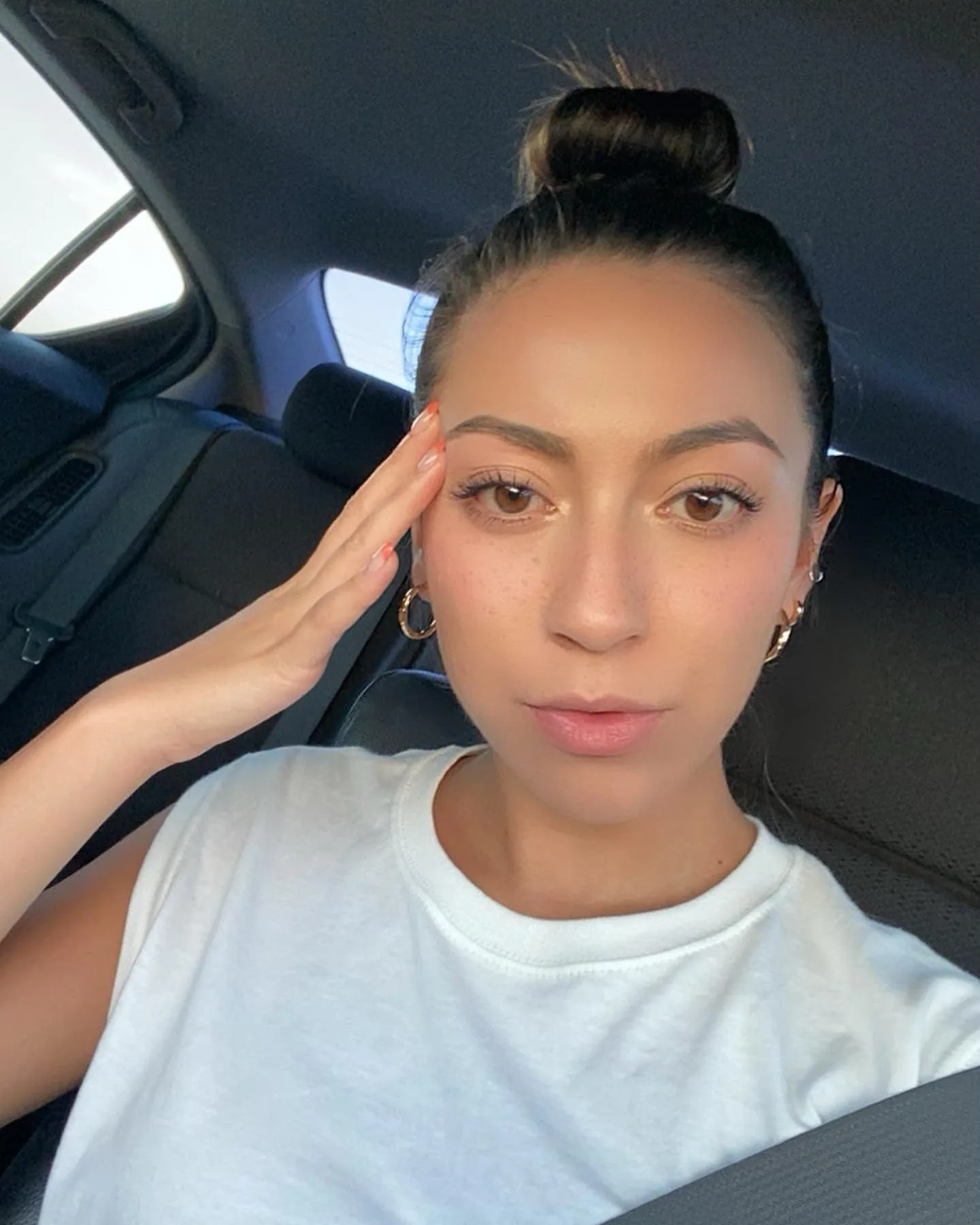 9. Natural Brunette Compact Bun with Clean Finish (Top Knot Hairstyles)