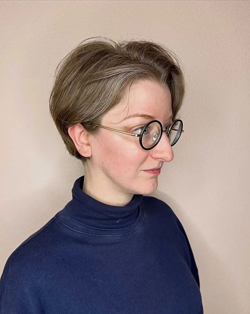 Ash brown bixie with deep side part and lifted volume