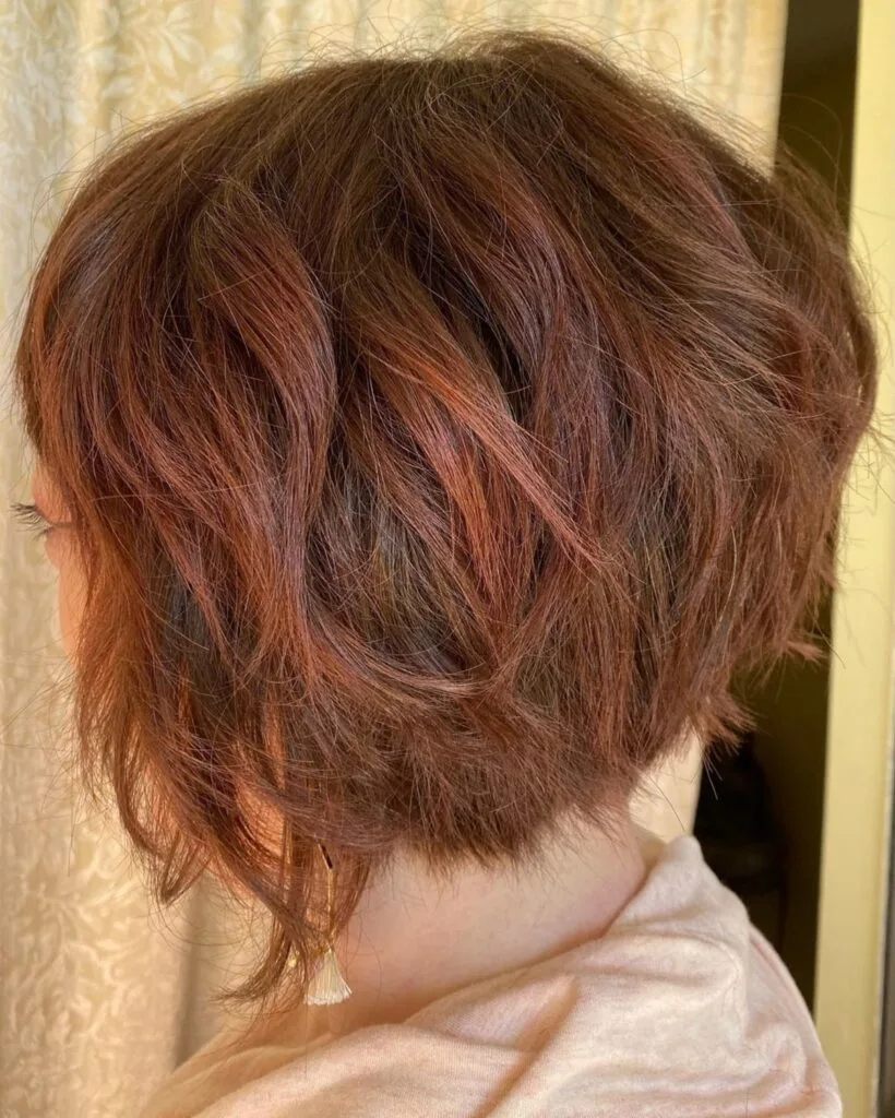 Auburn bob with layers for added volume for women 50+