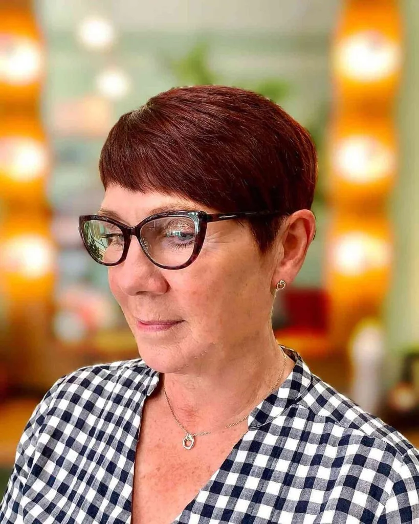 Bold Crimson Pixie with Side-Swept Infant Fringe for Ladies 60 and Up with Glasses