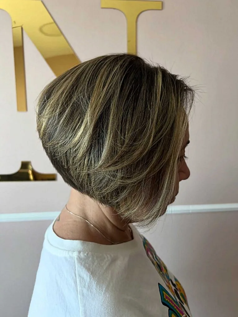 Brunette Inverted Bob with Chunky Blonde Foils and Layered Movement