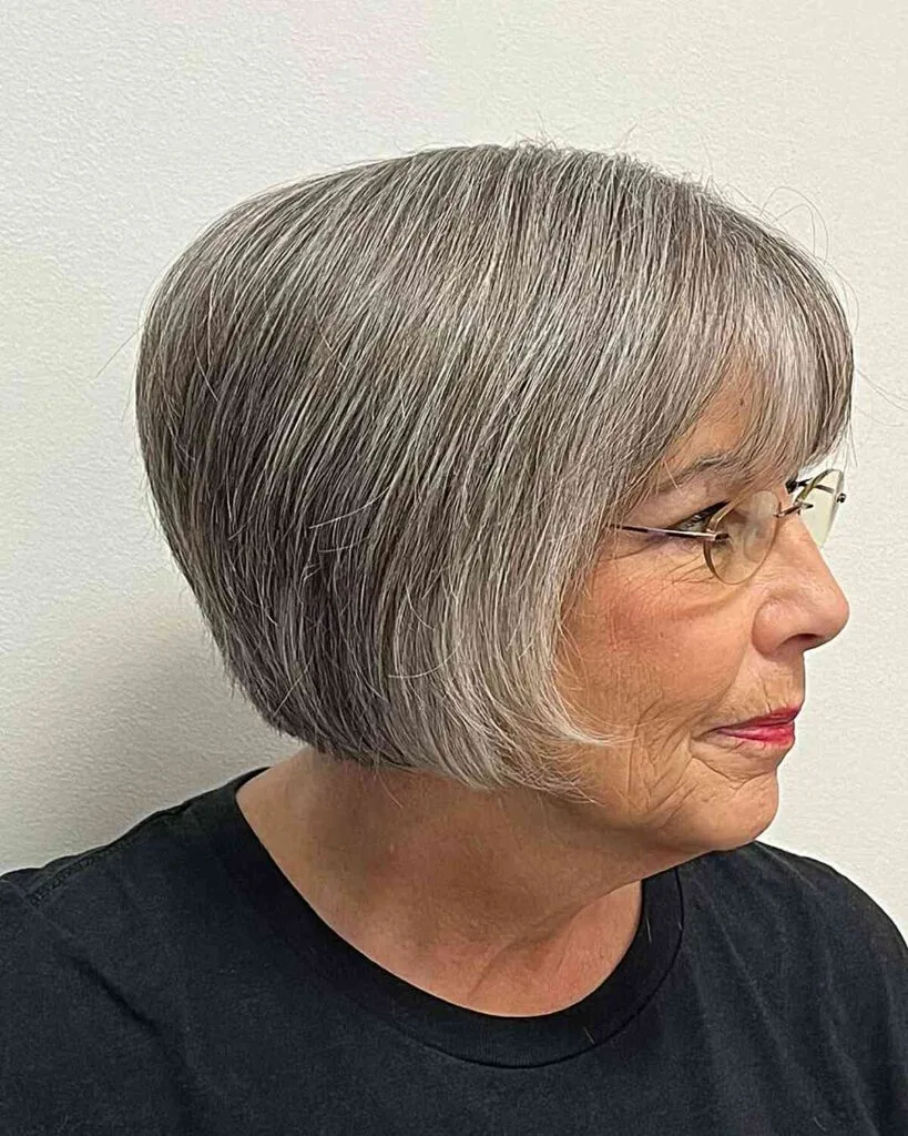 Charming Layered Bob Haircut for Women Over Sixty with Glasses