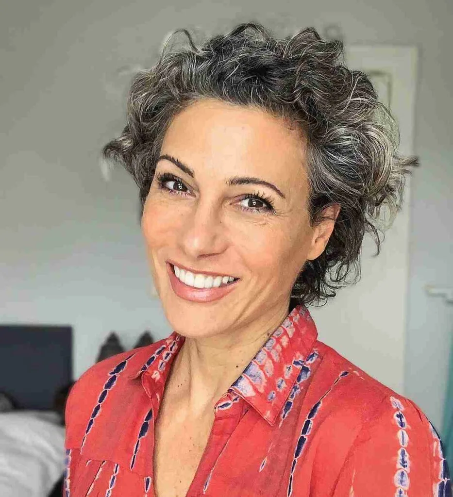 Chic Short Curly Style on Salt-and-Pepper Tresses for Women Over 50
