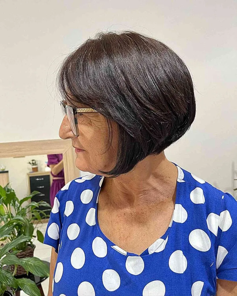 Chin-Length Graduated Bob Cut with Side Bangs for Older Adults Wearing Glasses