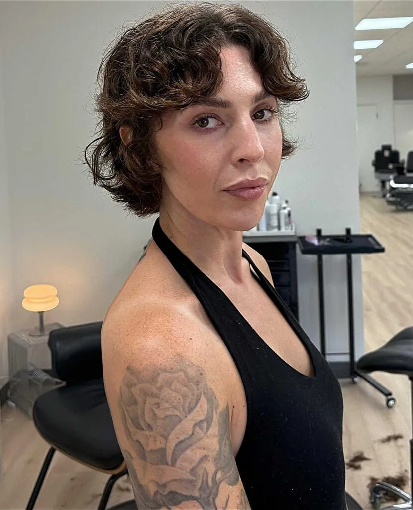 Dark brown curly bixie with voluminous ringlets