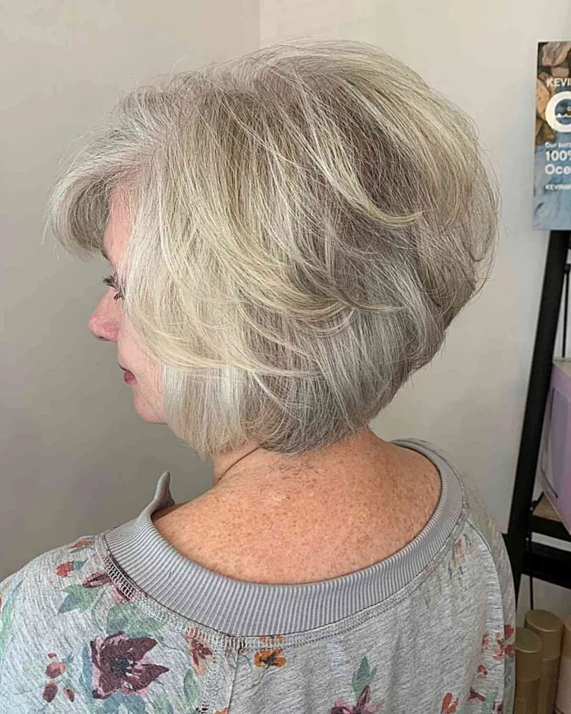 Feathered Pixie Bob with A-Line Hairstyle on ladies in their 50s with Straight, Grey Hair