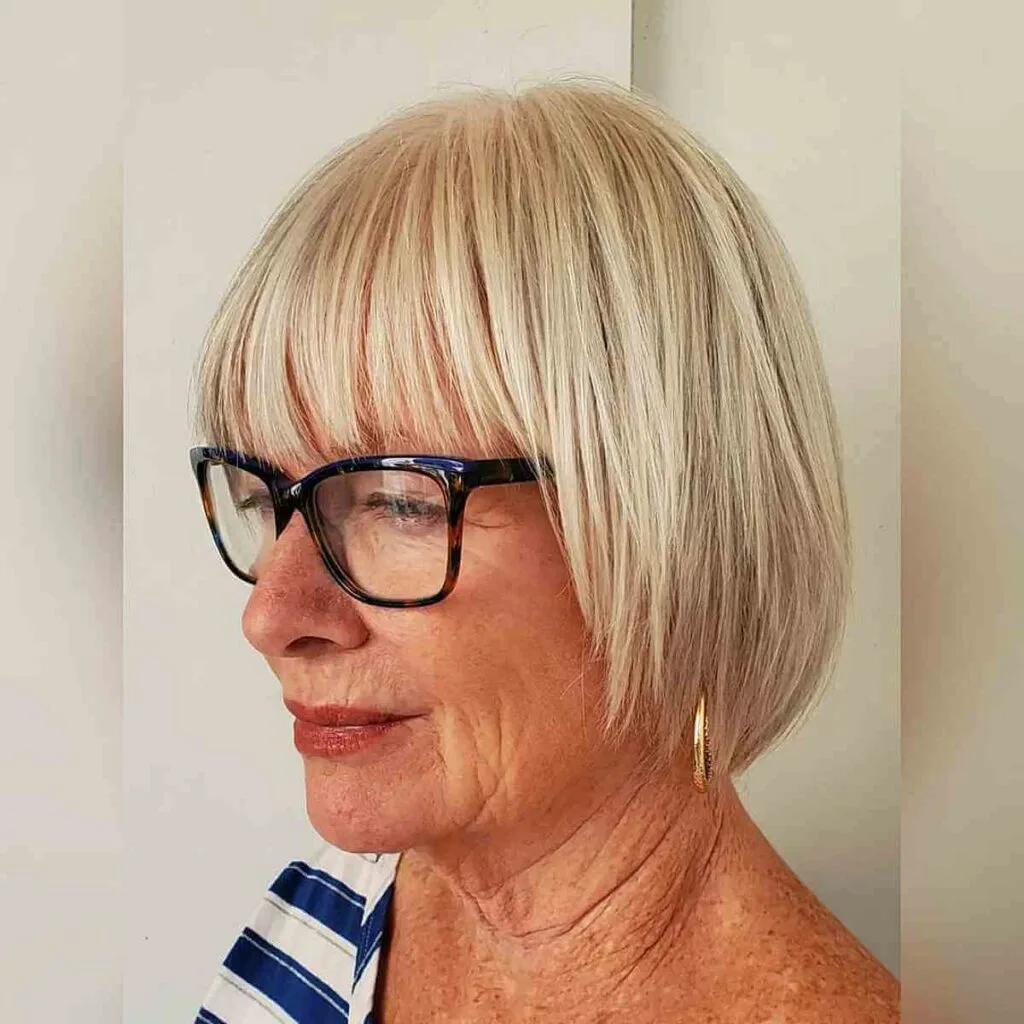layered bob with fringe for women over 60 with glasses