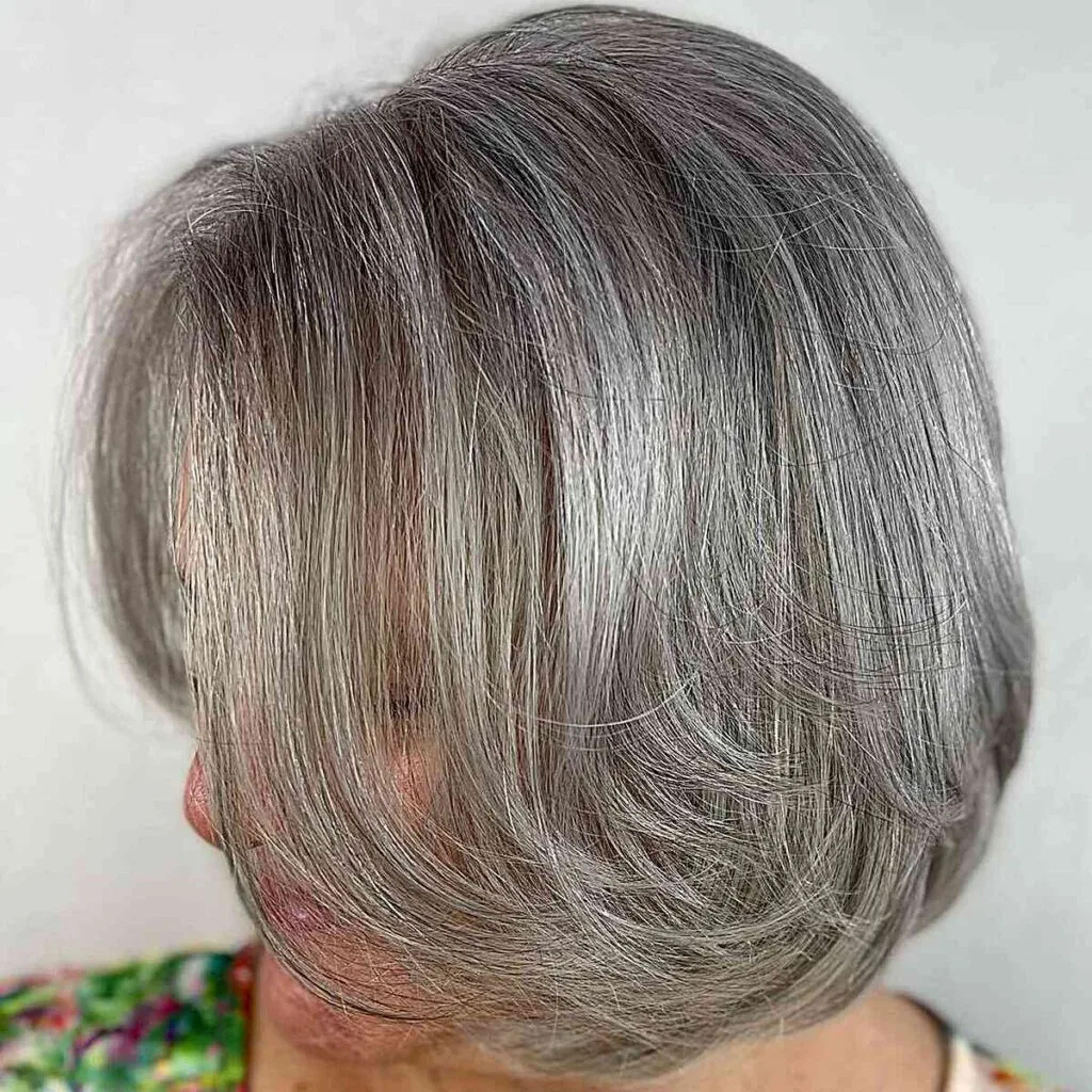 Layered long bob with enhanced volume for women over 50