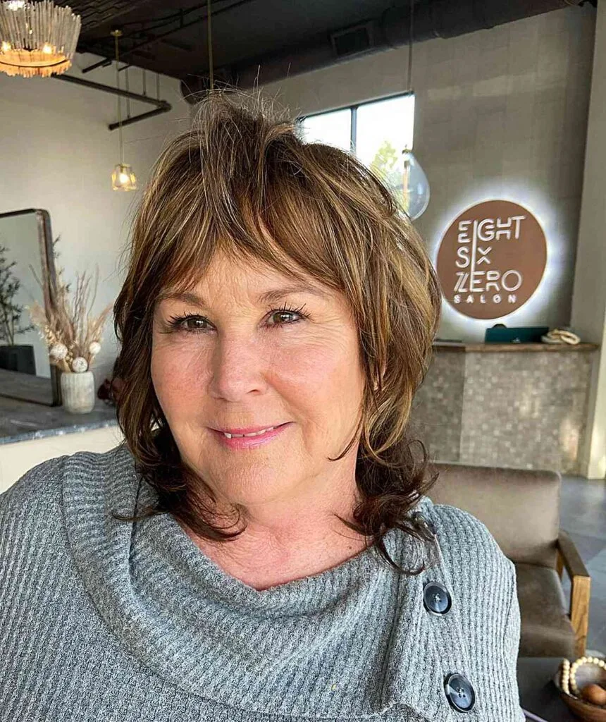 Medium Layered Modern Shag with Curtain Bangs for Thin Haired Women Over 50