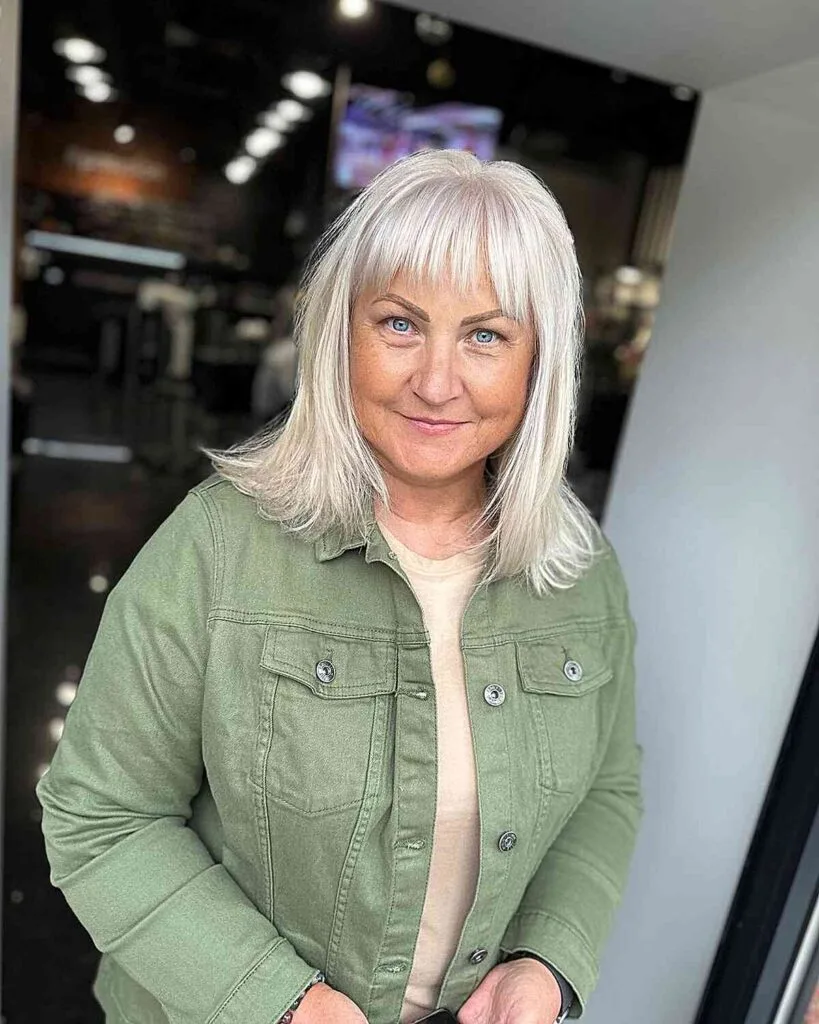 Medium Wispy Layers and Choppy Bangs for Fine-Haired Women Over 50