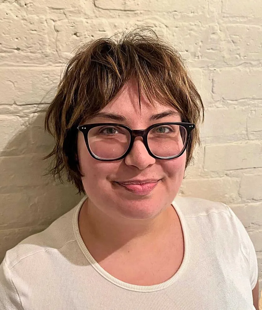 Messy lived-in brunette bixie with glasses and bangs