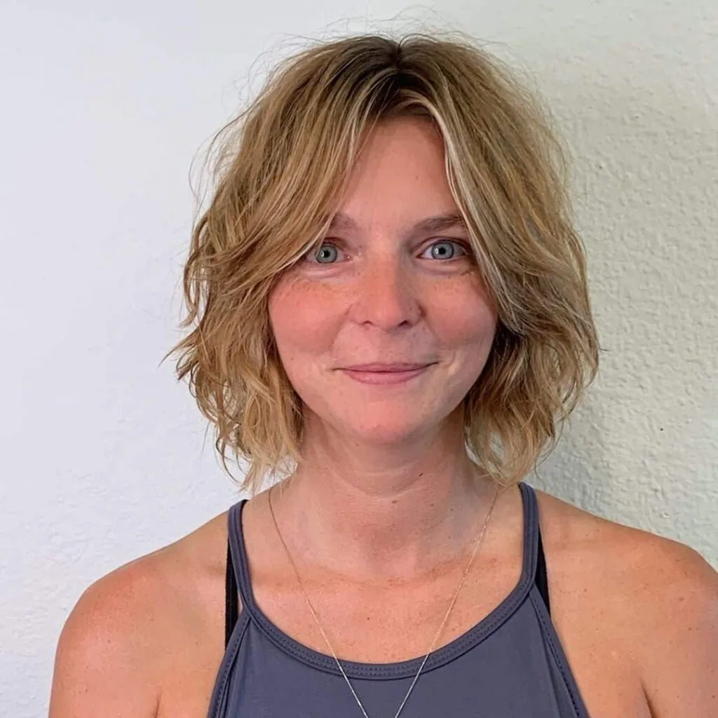 Neck-Length Messy Shag Hairstyle for Older Women Over 50 with Soft Curls