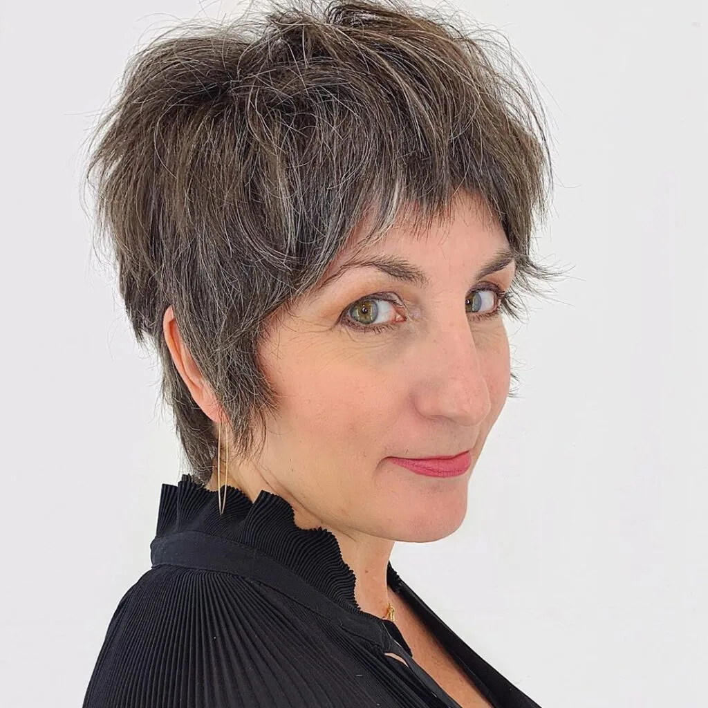 Neck length shag cut for a woman in her 50s and fine hair