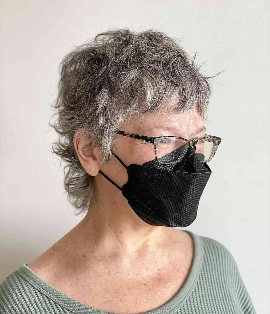 Pixie Mullet with Short Bangs for Curly Hair for a Lady Over Seventy