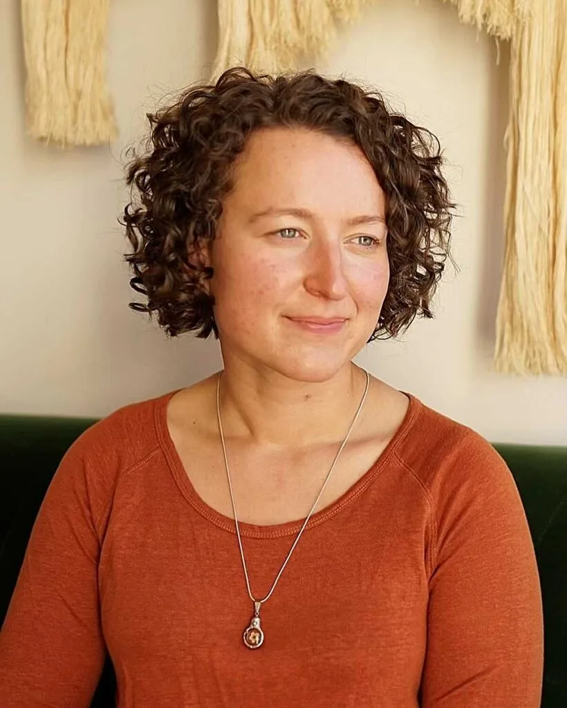Short cropped curly bob in warm brown with soft shape