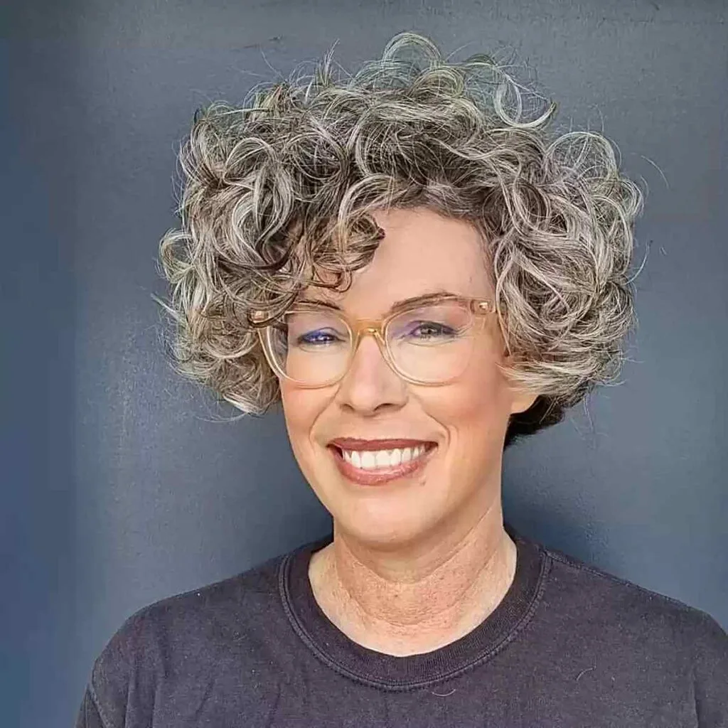 Short Hair with Bouncy Curls and Scissor-Over-Comb Technique on 50-Year-Old Women with Glasses