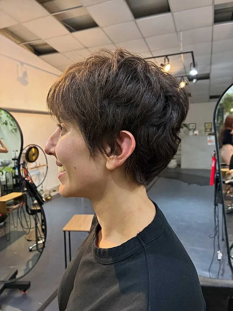 Short textured dark brown bixie with tapered nape