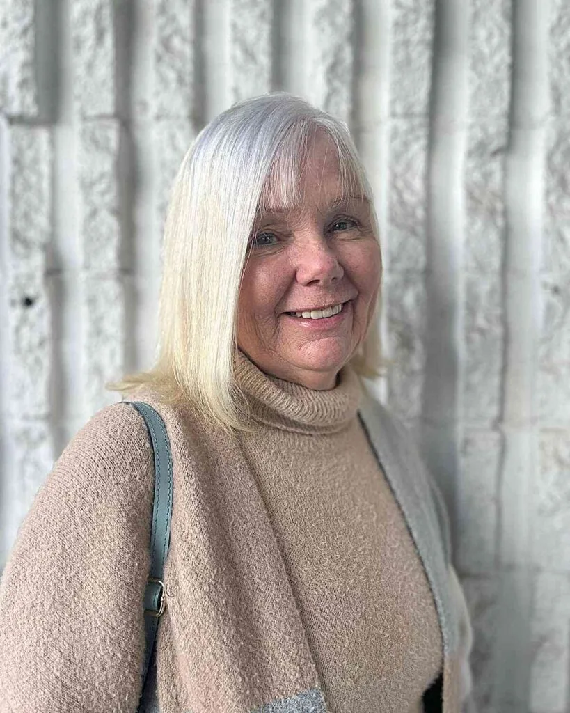 Shoulder-Grazing Straight Haircut with Very Thin Bangs for Grandmas Over Fifty