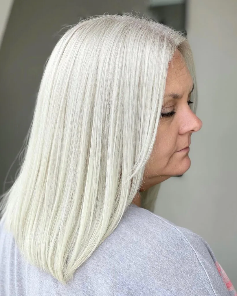 Sleek Long Platinum Blonde with Subtle Face-Framing Layers